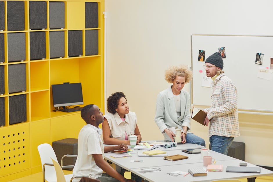 A diverse team holds a collaborative meeting in a modern office setting.